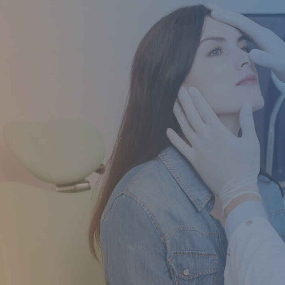 ENT doctor checking patient's nose for sinus issues