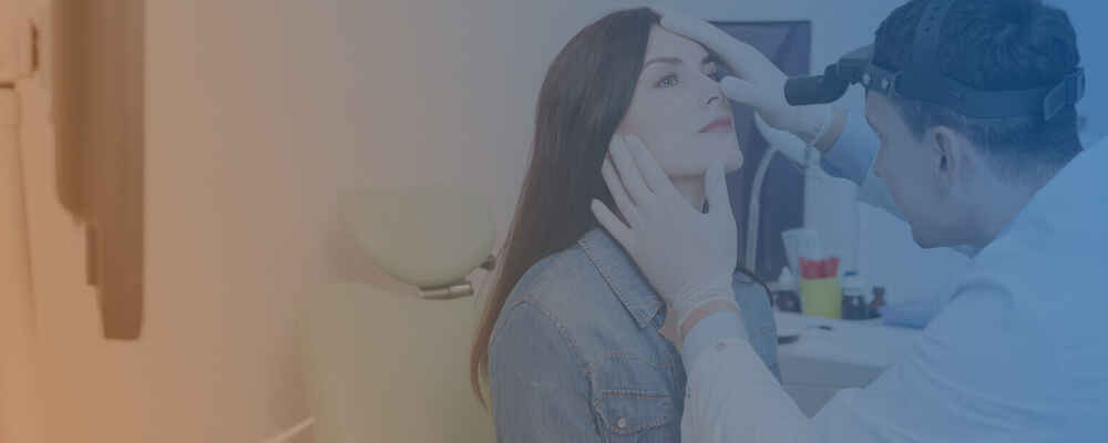 ENT doctor checking patient's nose for sinus issues